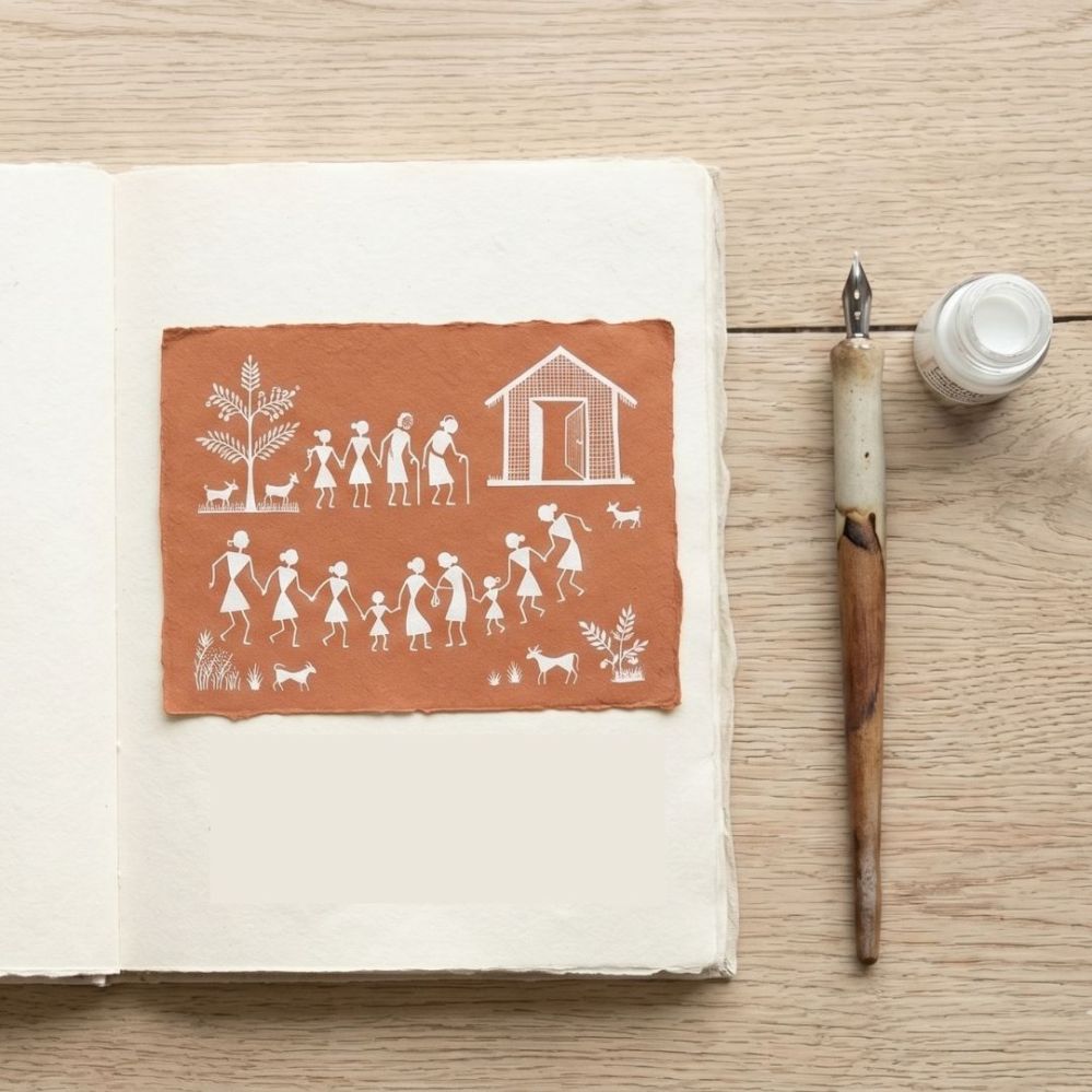 Traditional Warli art drawing of people holding hands outside a village home, highlighting inclusivity and belonging.